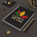 Hardcover Journal — "I Can't. We Can" Motivational Black Hardcover Journal with Pan-African Floral Design